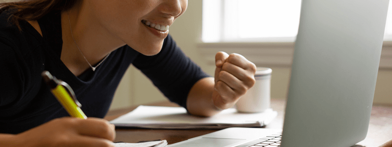 Lady checking credit score on laptop