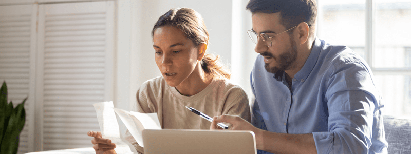 Woman and man by laptop