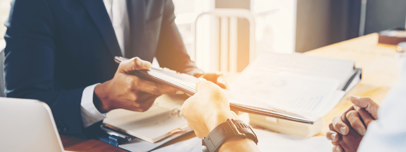 Man discussing loan paperwork