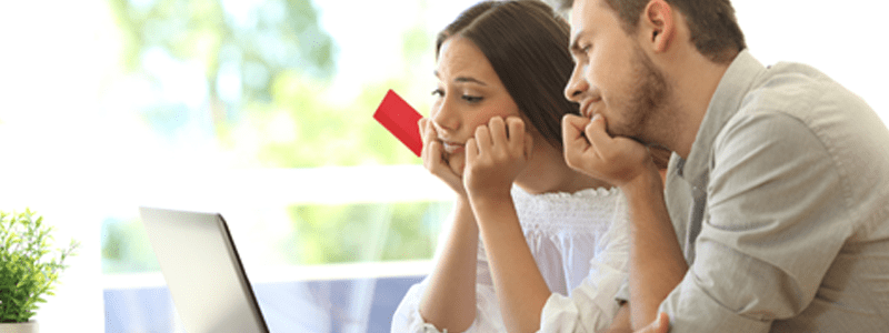 Couple looking at laptop