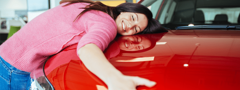 Lady hugging car